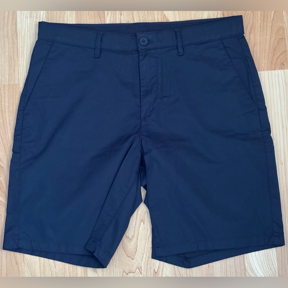 Calvin Klein Dark Blue Flat Front Shorts. Brand new — never used.